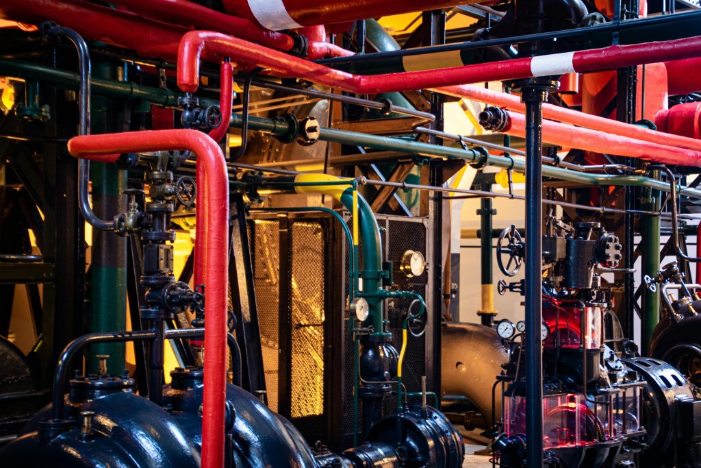pexels-photo-2569842-2569842 Complex network of industrial pipes and machinery inside a Lisbon plant.